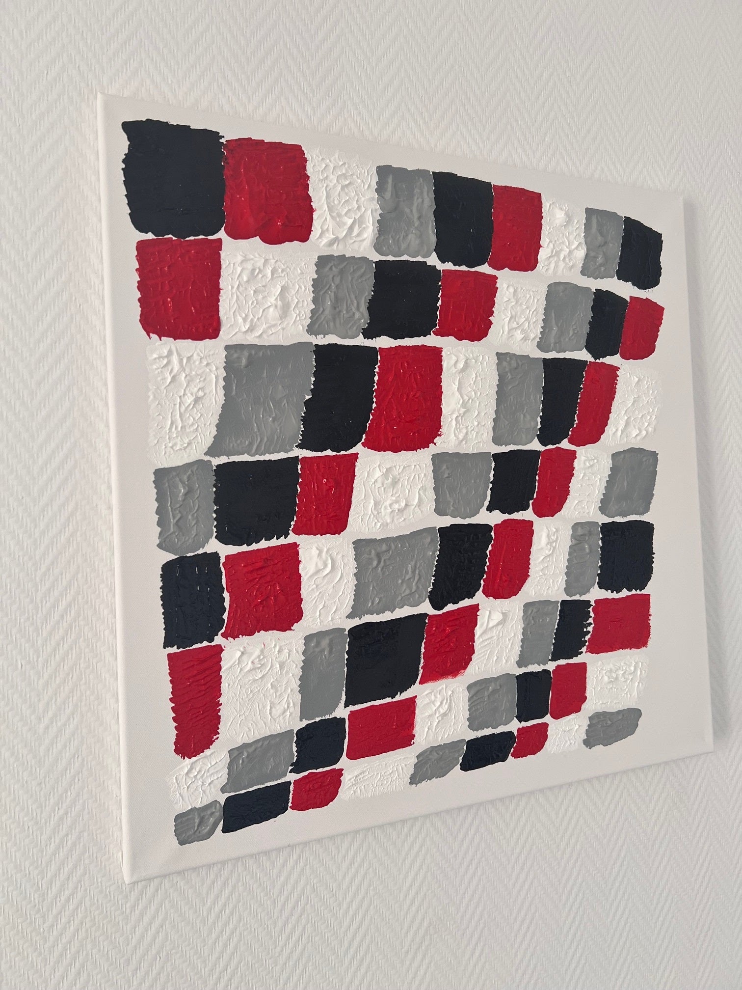 tableau  abstrait  sur toile  60x60 forme damier noir et rouge 